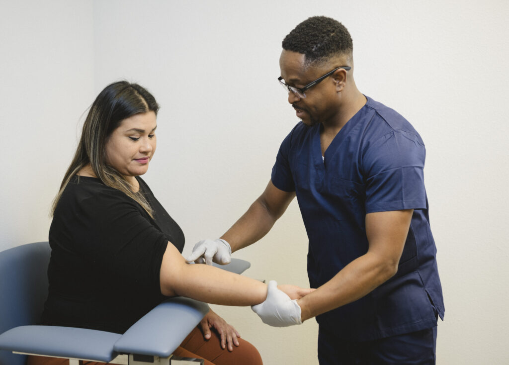 Phlebotomist looking for a vein